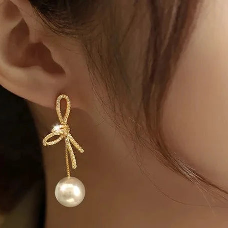【OTTOLINGER】上品×エッジィ ハンドメイド パールリボンピアス Ranking No. 1》SM-851 フォーチュンリボンパールピアス – Sunny